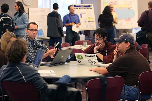 Web pros have a meeting of the minds during the annual HighEdWeb poster session.